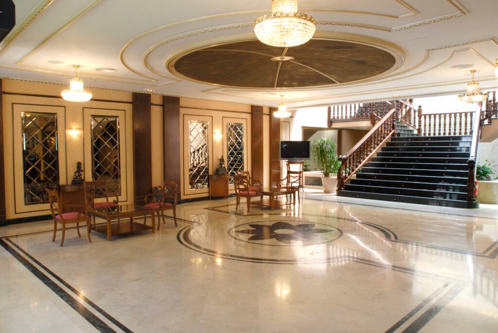 Main lobby with marble floor, domed ceiling and staircase