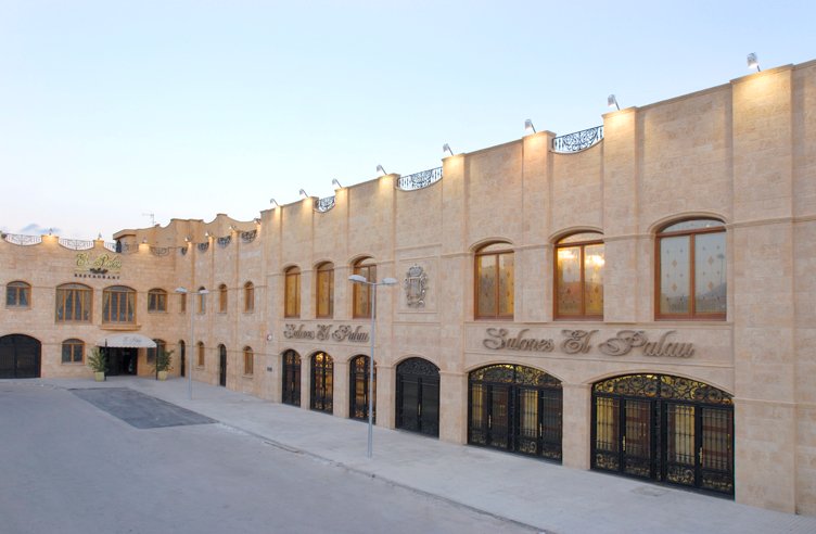 El Palau seen along the street — restaurant wing and main event entrances